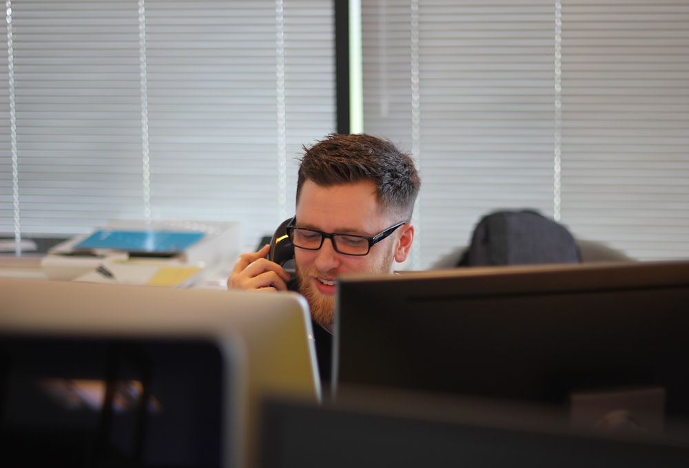 A business owner answering a phone call at the office